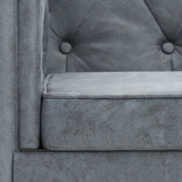 Sillón tapizado de tela gris